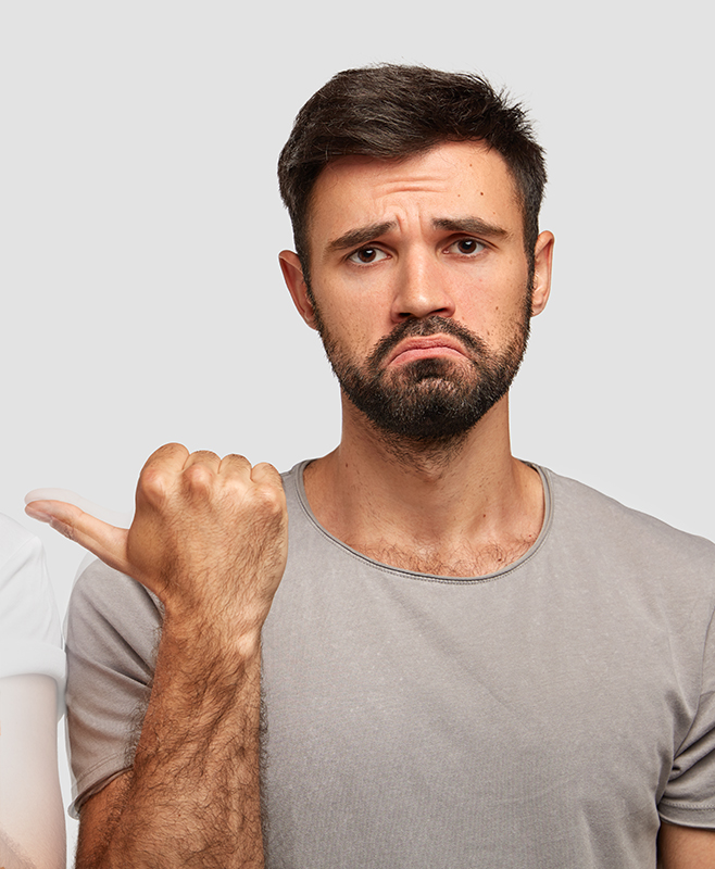 Cheerful ginger male in high spirit indicates at his companion with surprised expression, wear casual t shirts, express happiness and surprisement, isolated over white background. People and emotions Cheerful ginger male in high spirit indicates at his companion with surprised expression, wear casual t shirts, express happiness and surprisement, isolated over white background. People and emotions