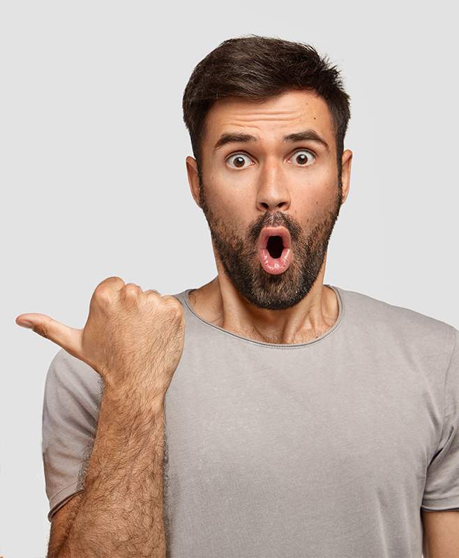Cheerful ginger male in high spirit indicates at his companion with surprised expression, wear casual t shirts, express happiness and surprisement, isolated over white background. People and emotions Cheerful ginger male in high spirit indicates at his companion with surprised expression, wear casual t shirts, express happiness and surprisement, isolated over white background. People and emotions